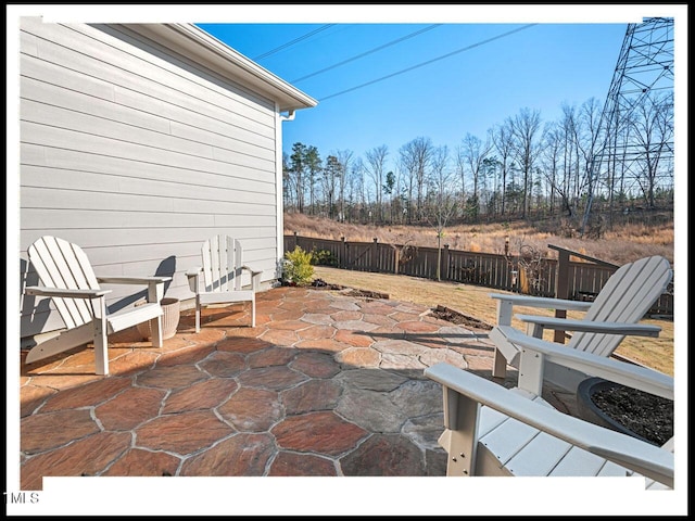 view of patio featuring fence