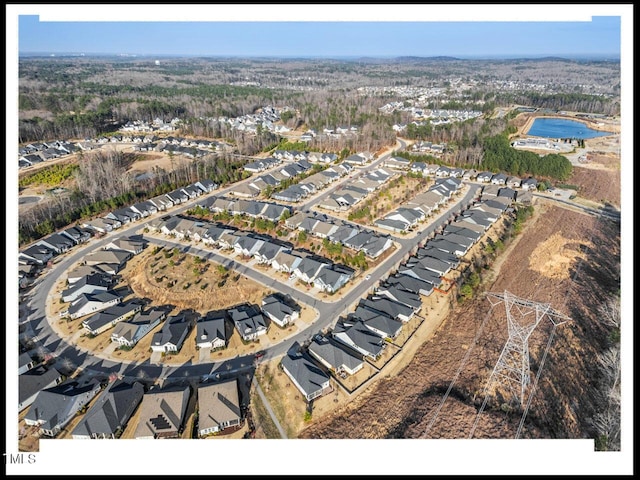 birds eye view of property with a residential view