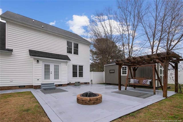 rear view of house featuring an outdoor fire pit, french doors, a pergola, and a patio