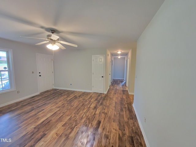 unfurnished room with ceiling fan and dark hardwood / wood-style floors