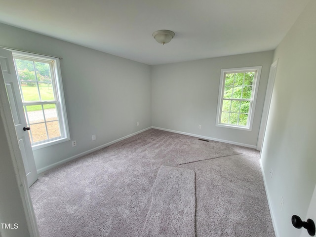 empty room with light colored carpet