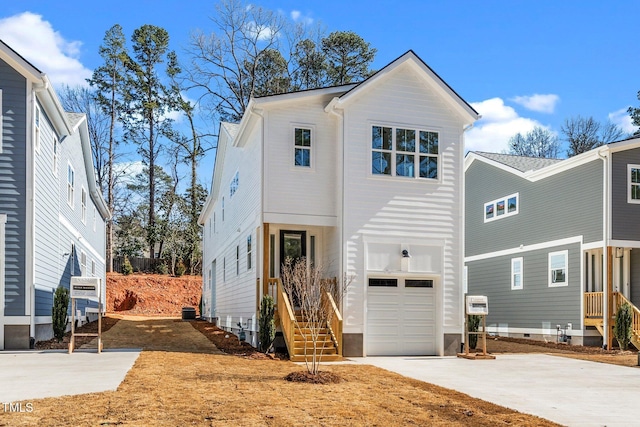 view of front of home featuring driveway and an attached garage