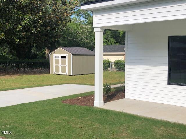 412 N Green St, Selma, NC 27576 - view of yard featuring a storage unit
