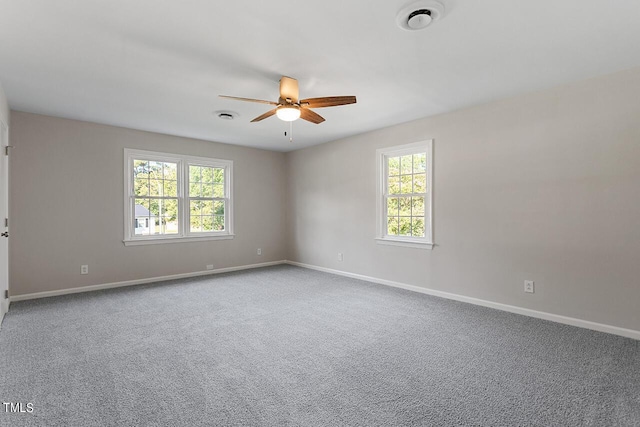 spare room with ceiling fan and carpet flooring