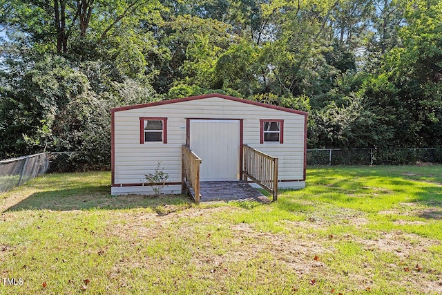 view of outbuilding with a lawn