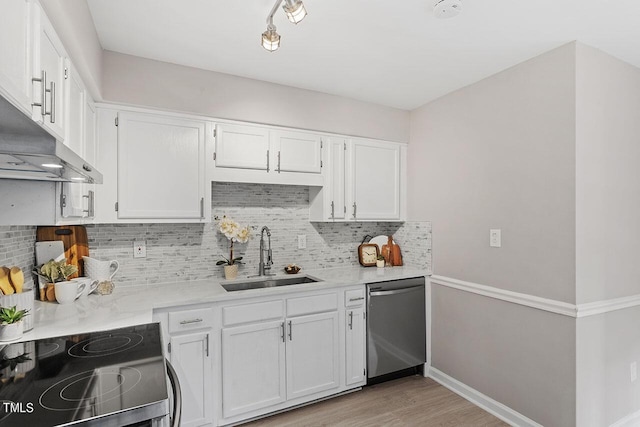 kitchen with white cabinets, light countertops, stainless steel dishwasher, a sink, and range with electric stovetop