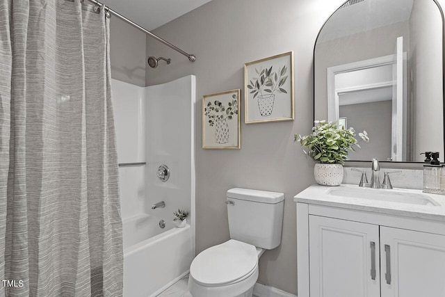 bathroom featuring vanity, toilet, and shower / bath combo with shower curtain