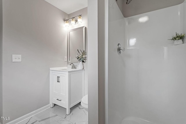 full bathroom with toilet, baseboards, walk in shower, and vanity