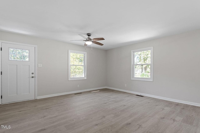 entrance foyer featuring ceiling fan and light wood-type flooring