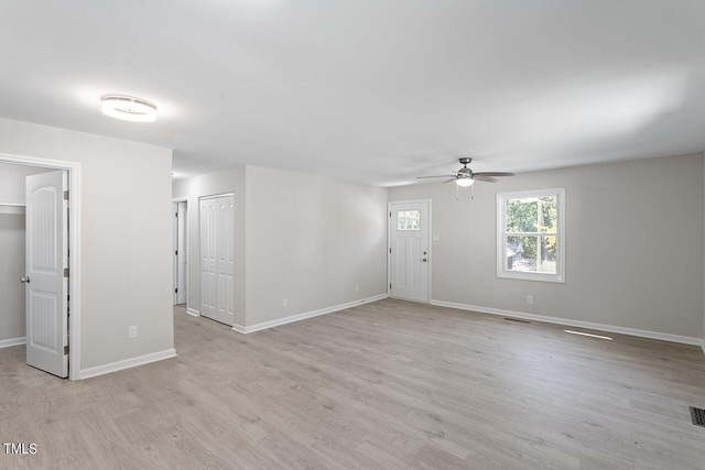 interior space with ceiling fan and light wood-type flooring