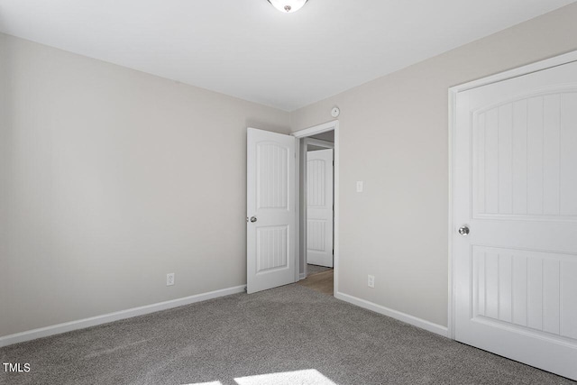 unfurnished bedroom with carpet floors