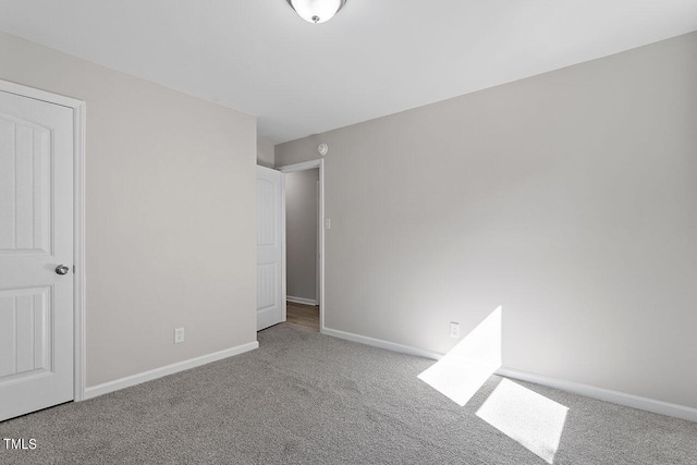 unfurnished bedroom featuring light carpet