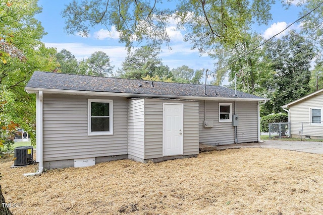 rear view of house featuring cooling unit