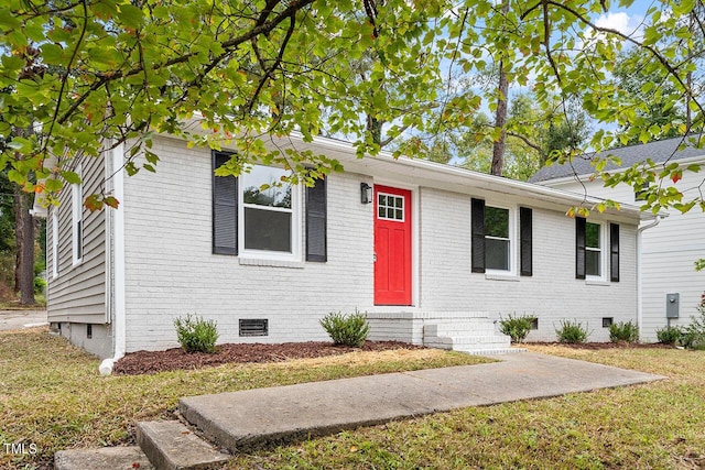 ranch-style house with a front lawn