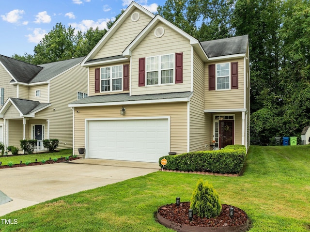 view of front of property featuring a front yard and a garage