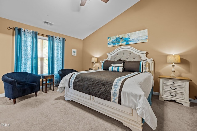 carpeted bedroom with vaulted ceiling and ceiling fan