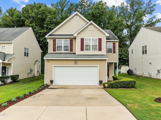 view of front of home with a garage and a front lawn