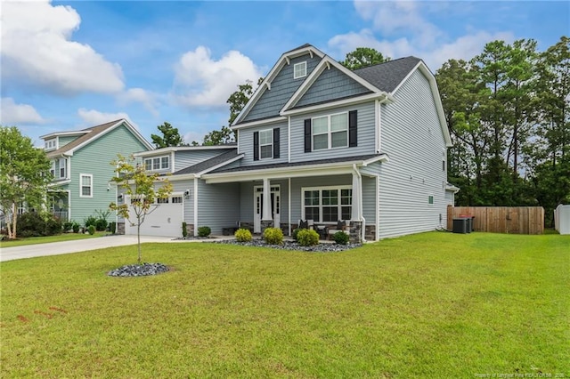 craftsman inspired home with central AC, a garage, covered porch, and a front yard