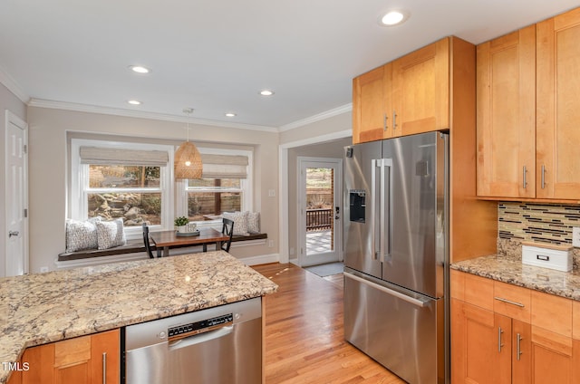 kitchen featuring light wood-style floors, backsplash, appliances with stainless steel finishes, and ornamental molding