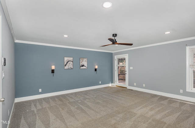 carpeted empty room featuring recessed lighting, baseboards, crown molding, and ceiling fan