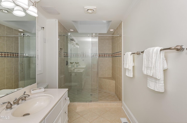 full bath with tile patterned flooring, a shower stall, vanity, and baseboards