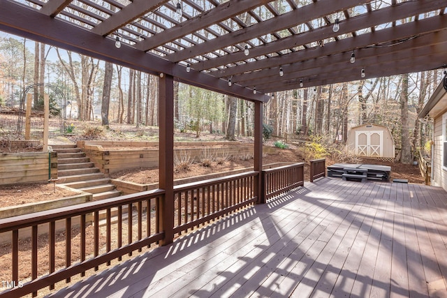 deck with a storage unit, an outdoor structure, and a pergola