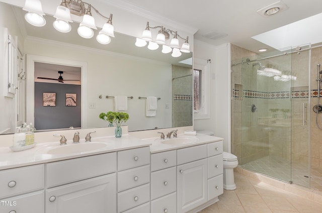 bathroom with a stall shower, crown molding, and a sink