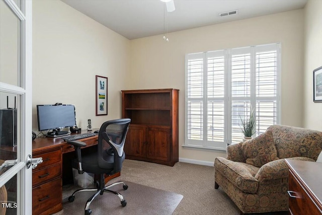 office area featuring visible vents, baseboards, and carpet floors