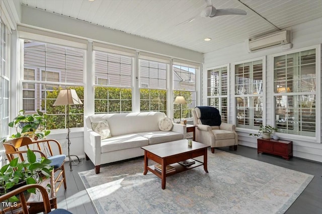 sunroom / solarium with plenty of natural light, an AC wall unit, wooden ceiling, and a ceiling fan