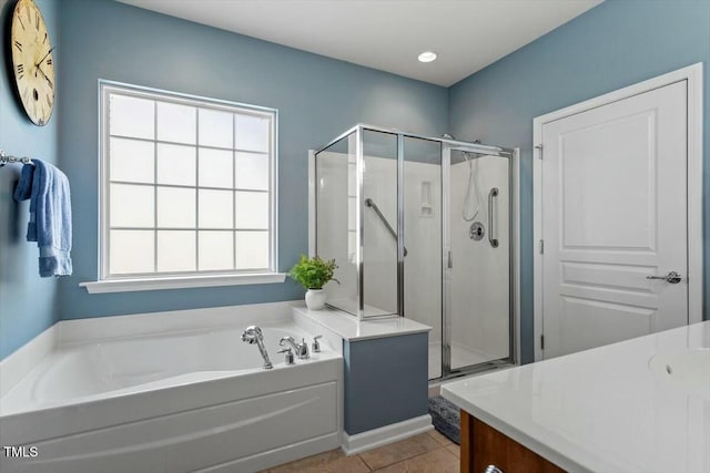 bathroom with vanity, a garden tub, tile patterned floors, and a shower stall