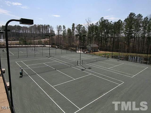 view of sport court with fence