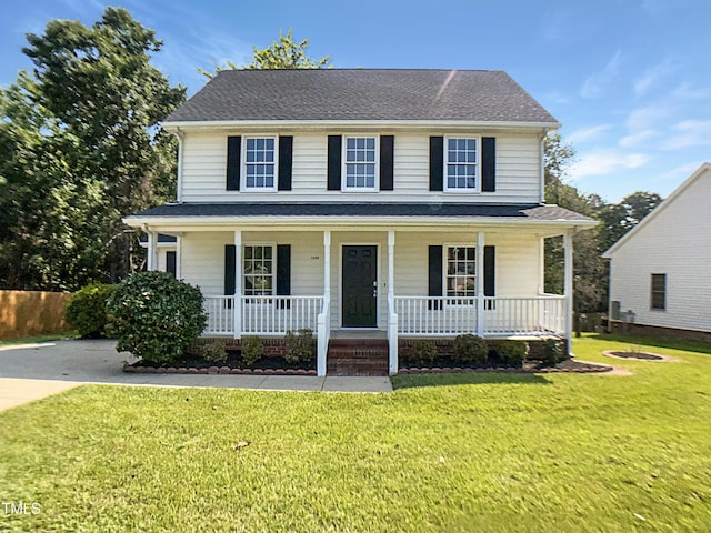 1599 Rogers Pointe Ln, Creedmoor, NC 27522 - colonial house with covered porch and a front yard
