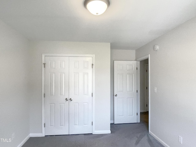 1599 Rogers Pointe Ln, Creedmoor, NC 27522 - unfurnished bedroom featuring dark carpet and a closet