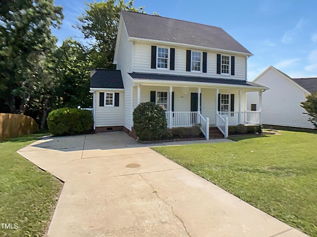 1599 Rogers Pointe Ln, Creedmoor, NC 27522 - view of front facade with covered porch, a front lawn, crawl space, and concrete driveway