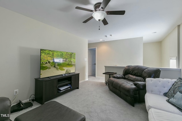 living area with light colored carpet and baseboards