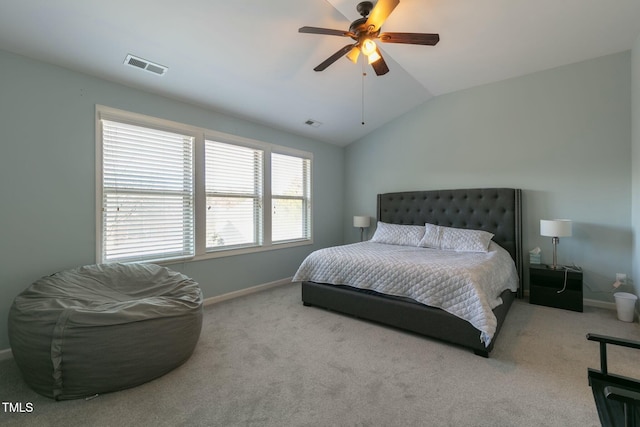 carpeted bedroom with vaulted ceiling, ceiling fan, visible vents, and baseboards