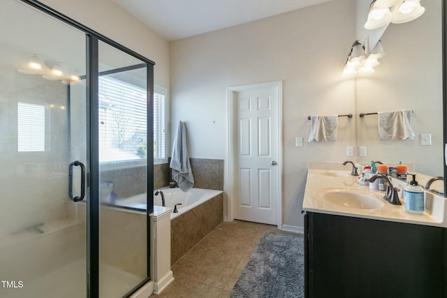 full bath featuring a stall shower, a garden tub, a sink, and tile patterned floors