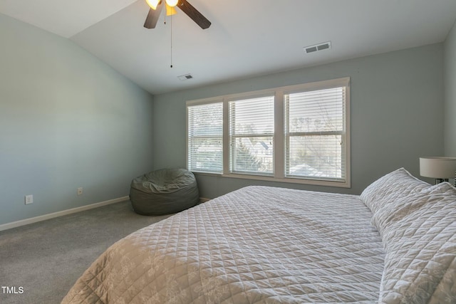 bedroom with carpet floors, baseboards, visible vents, and vaulted ceiling