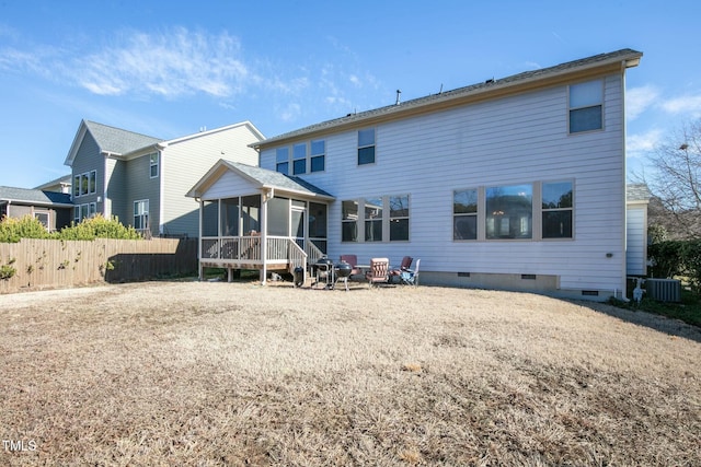 rear view of property featuring crawl space, a sunroom, fence, and central AC unit