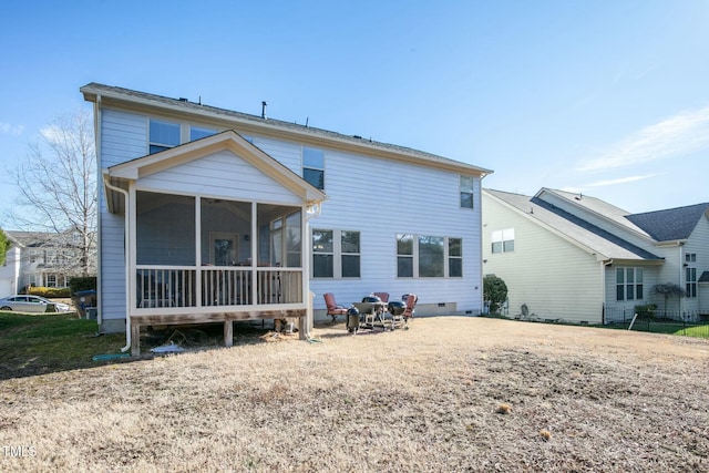 rear view of property featuring crawl space and a sunroom