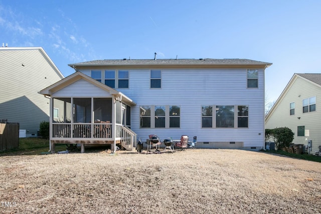 back of house featuring a sunroom and crawl space