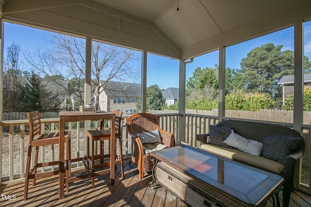 sunroom with vaulted ceiling