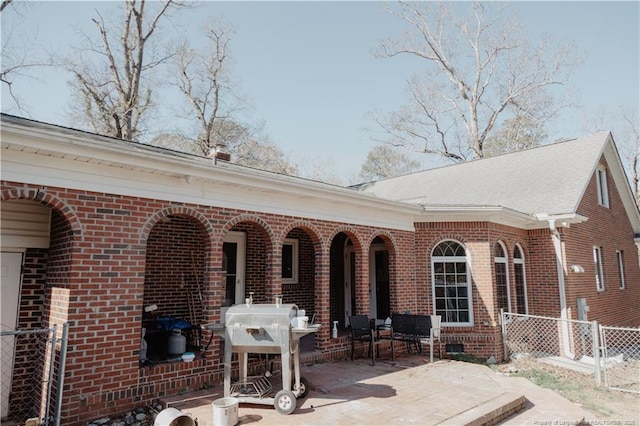 back of property featuring a patio area