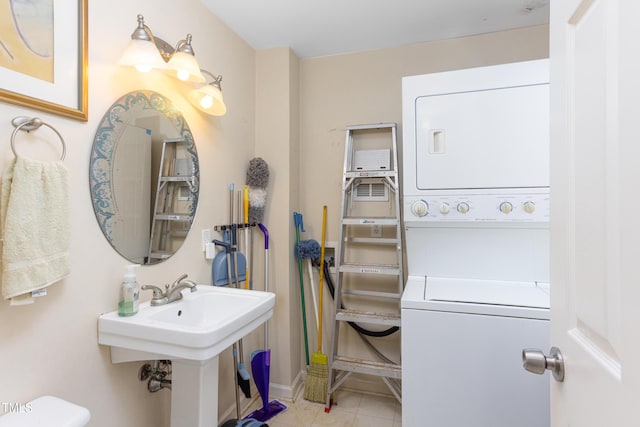 bathroom featuring sink and stacked washer and clothes dryer