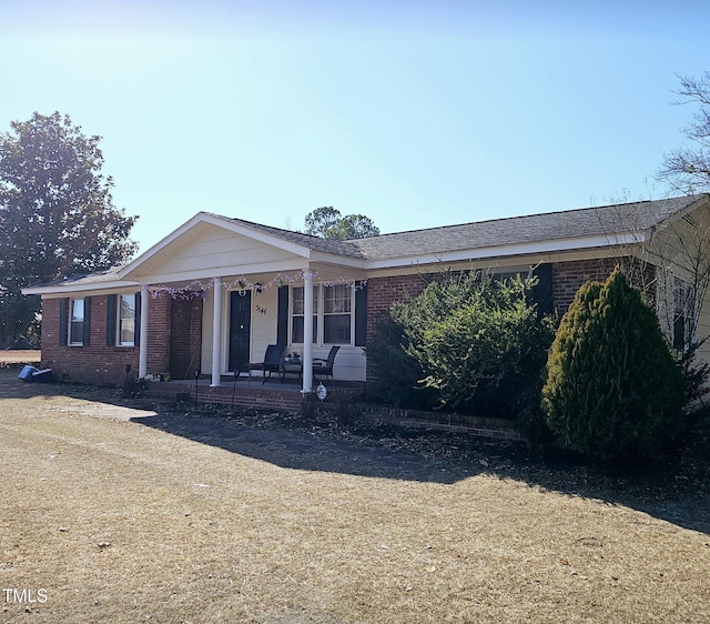 ranch-style house with covered porch