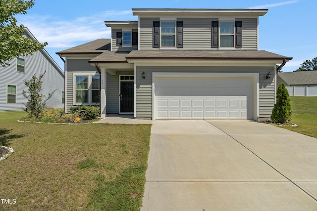 view of front of property with a garage and a front yard