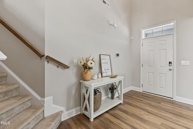 entryway with hardwood / wood-style floors