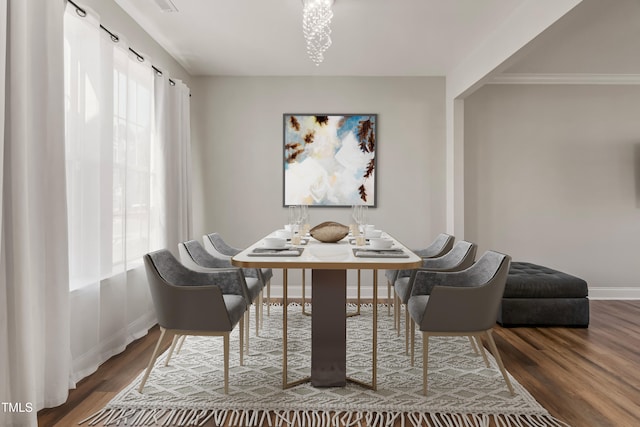 dining space with a healthy amount of sunlight and wood-type flooring