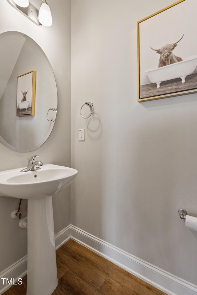 bathroom featuring sink and hardwood / wood-style floors