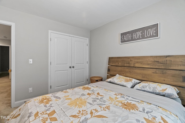 bedroom with a closet and carpet